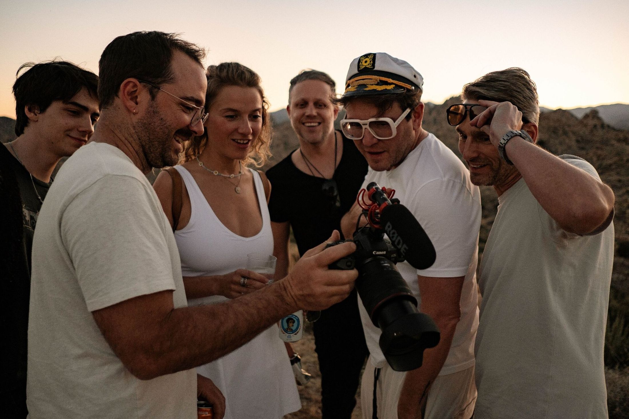A production crew filming on location at ESCAPE