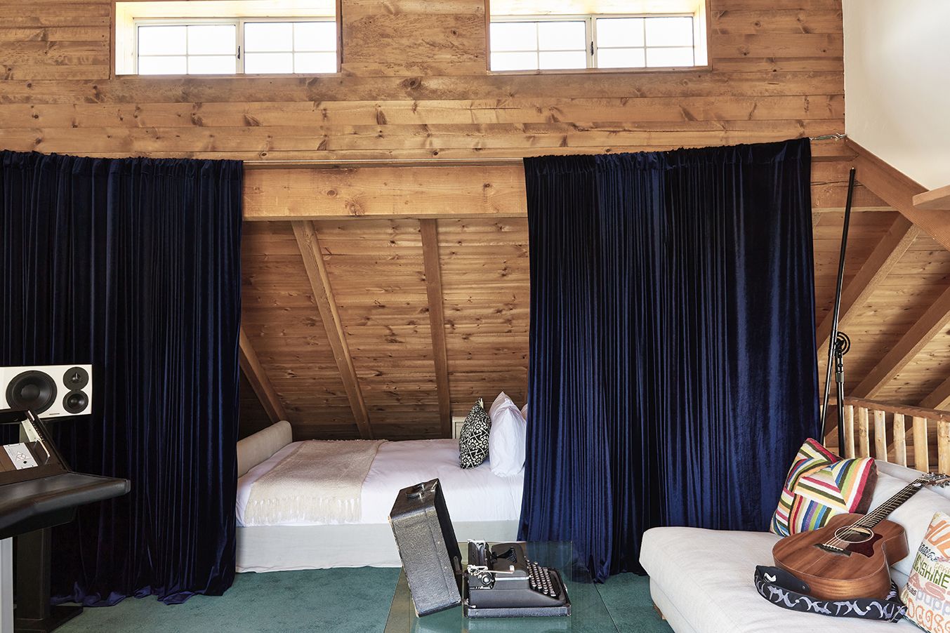 The Songwriting Suite inside the Residence — sofa with a window onto the desert