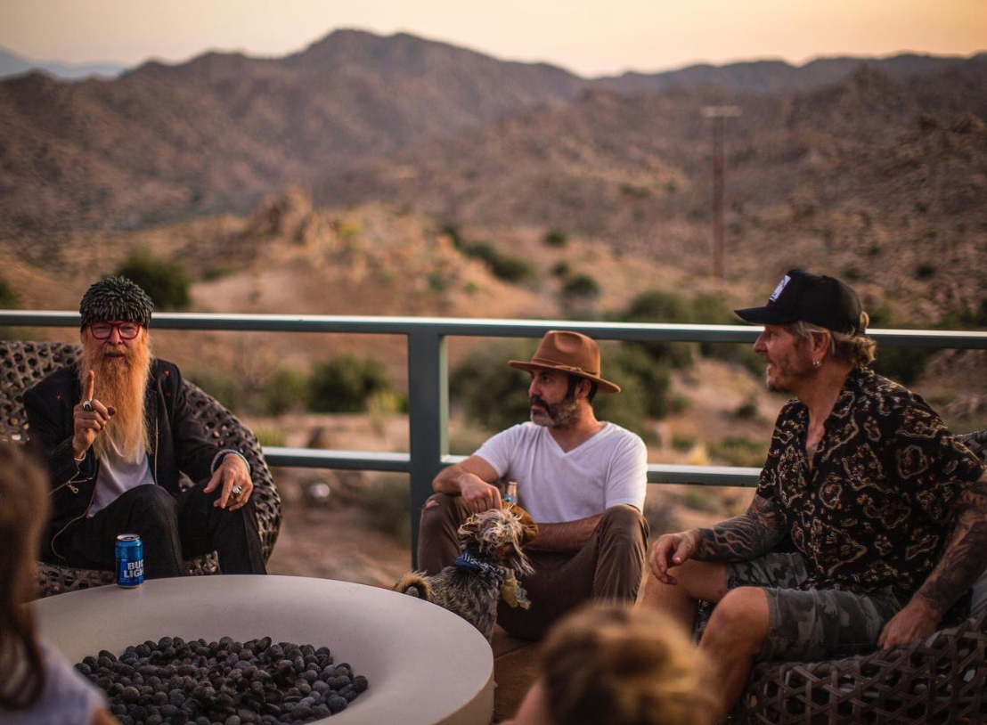 Billy Gibbons and Matt Sorum at the firepit at sunset at ESCAPE