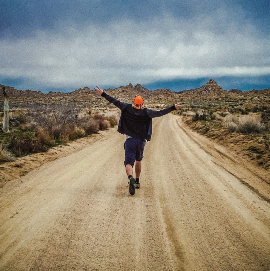 A dirt road running out into the open high desert at ESCAPE