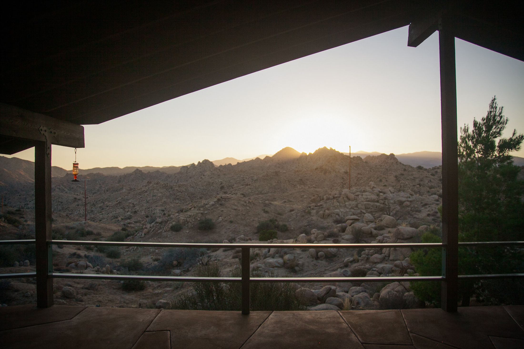 The Main House at ESCAPE at sunset — band accommodation on-property in Pioneertown, California