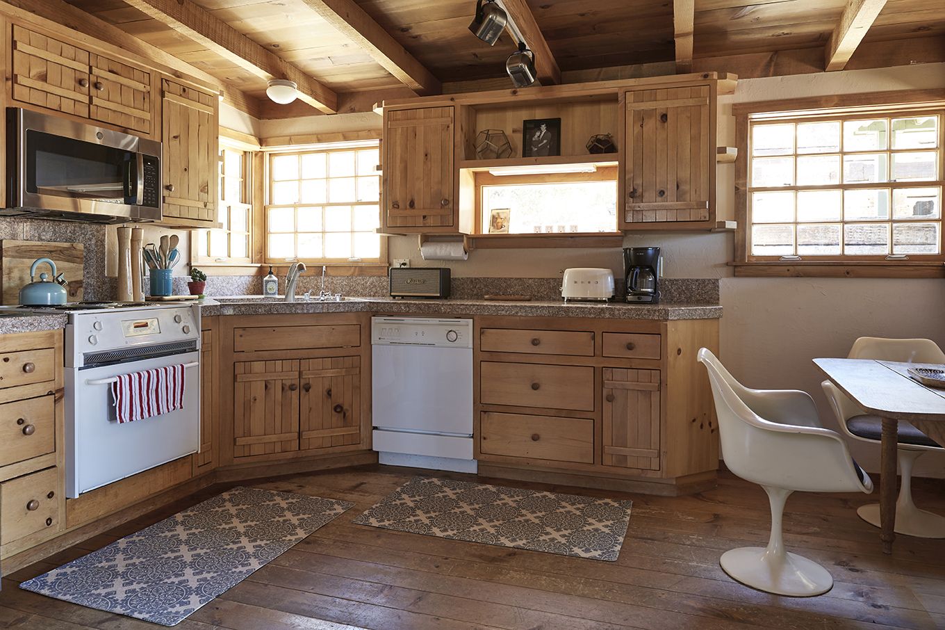 The Residence kitchen in pine, with tulip chairs