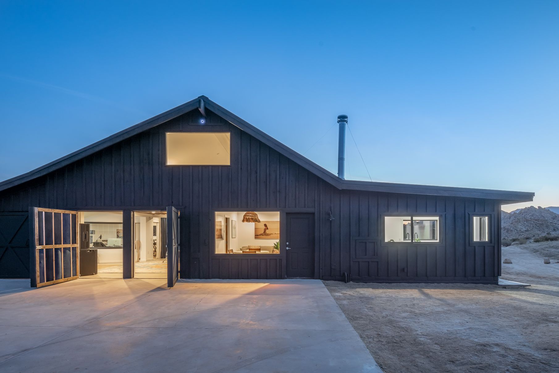 The Lodge at night, doors open to the live room