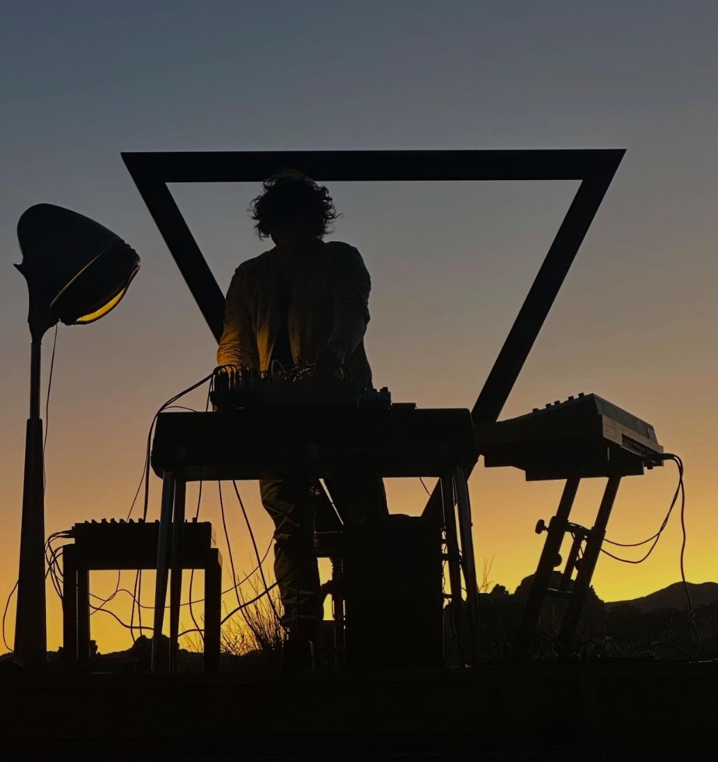 Romain Collin performing live at The Triangle at ESCAPE — an open-air desert stage in Pioneertown, California